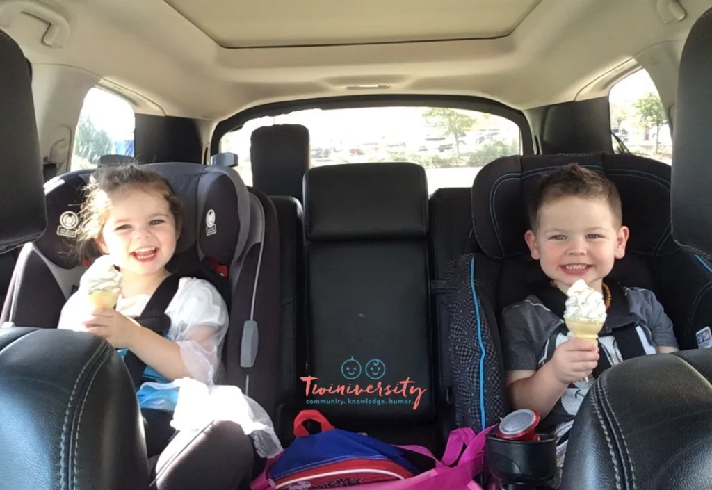 Happy Twin toddlers in the car