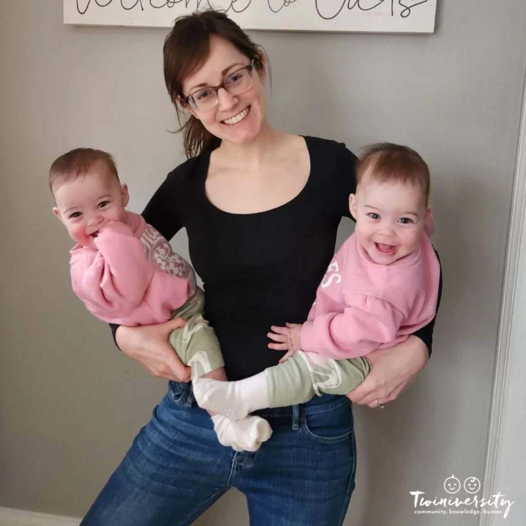 mom holding her two twin baby girls