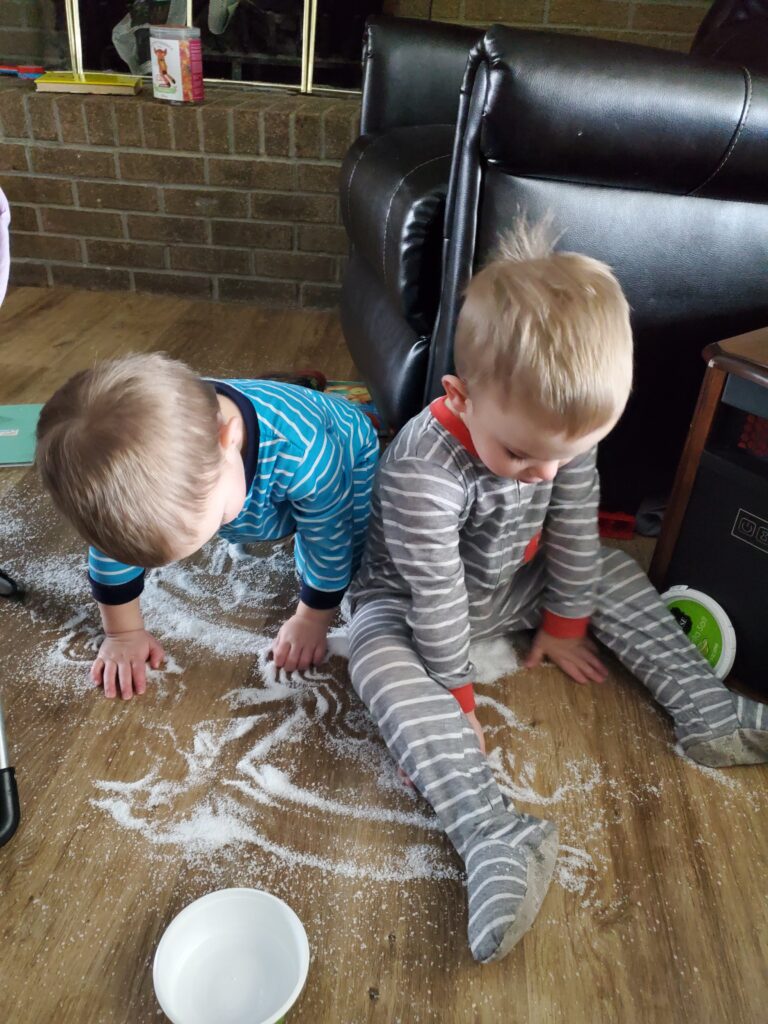 twin boys making a mess 