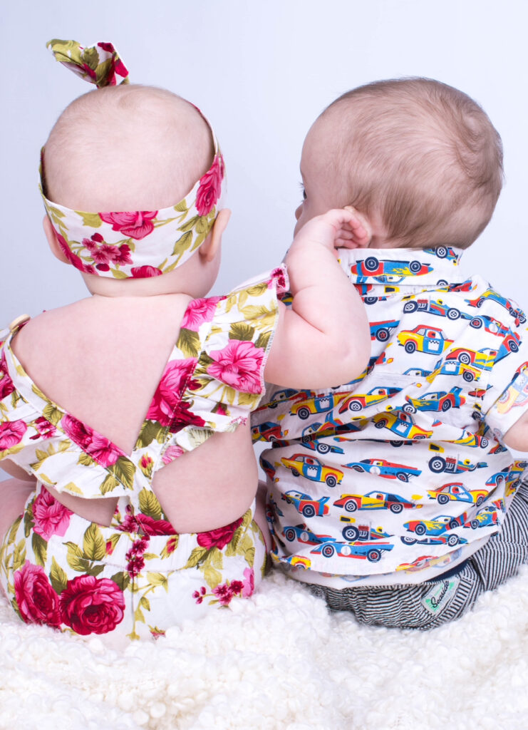 boy girl twins in outfits bought from baby registry