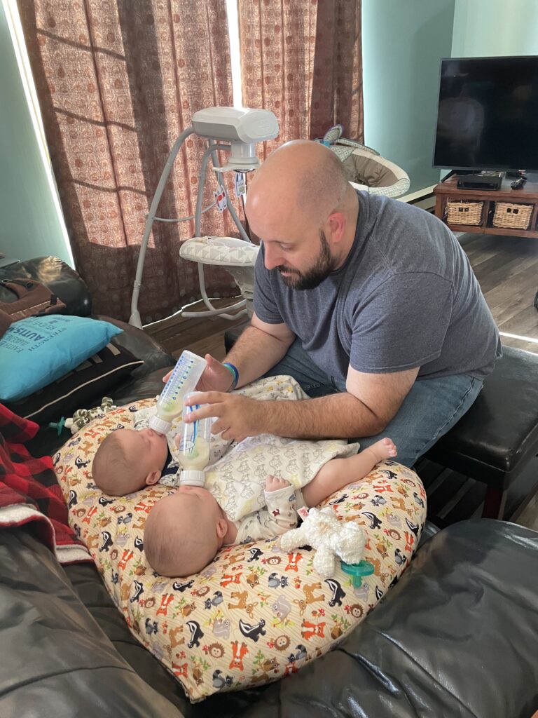 twin dad feeding babies